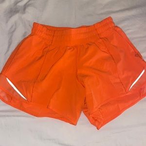 Highlight orange Lululemon 4” Hotty Hot Shorts
